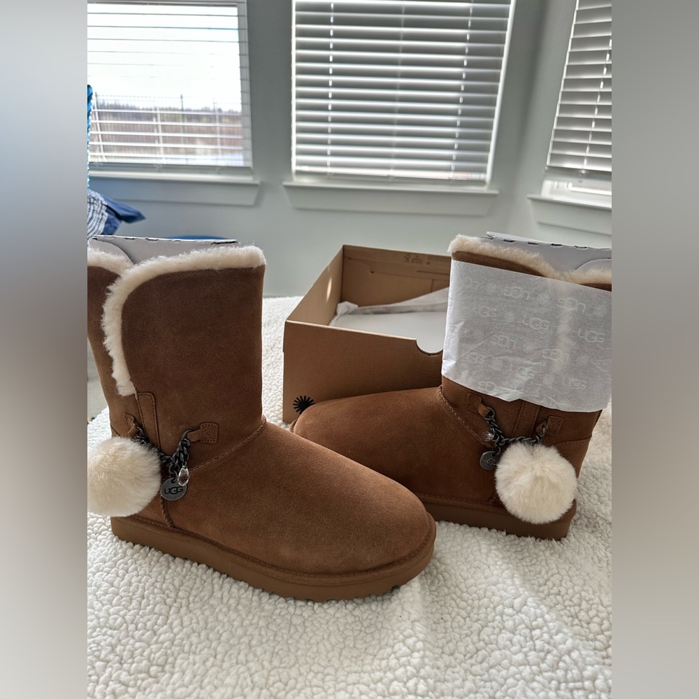 Brand new UGG Classic Short with Ugg Charm and Pom Pom. Size 12 in Chestnut CUTE